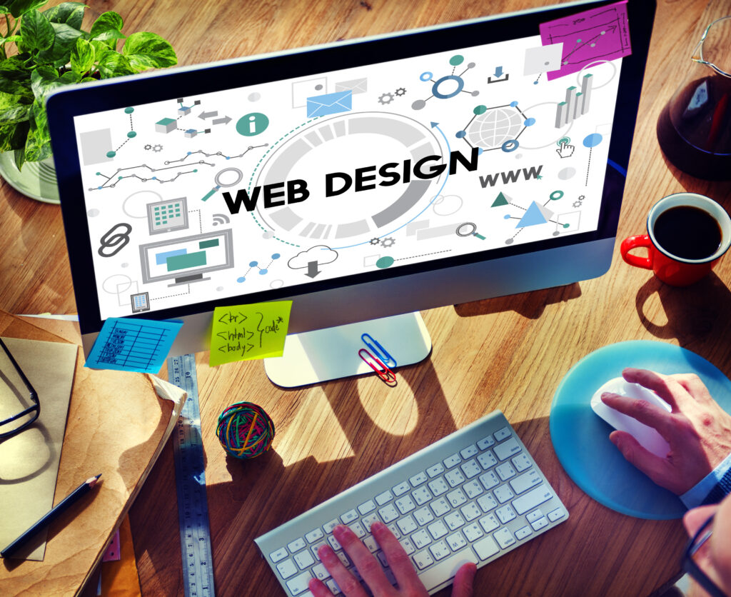 Web design workspace with computer and tools