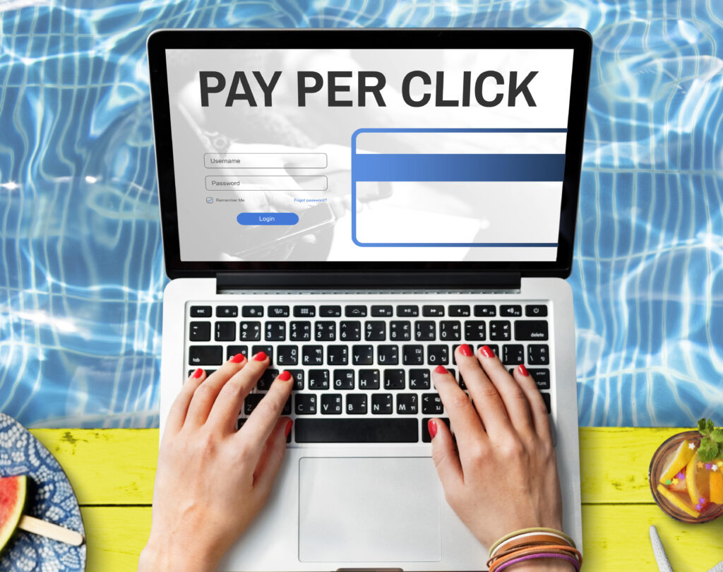 Laptop Displaying PPC Ads and Login Page for Digital Marketing